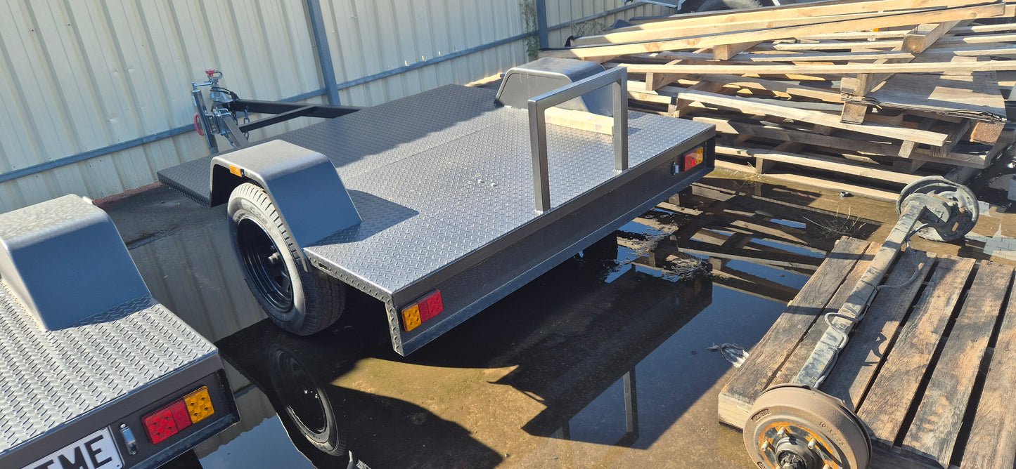 1800x1220 1400kg ATM Hydraulic Braked Spitwater Low Deck Trailer, Checker Plate Floor, Spare, Heavy Duty Jockey Wheel, Spare Wheel Winder, Charcoal Paint, Etch Primed and Painted, Australian Steel, Full Checker Plate Floor **NO REGISTRATION**